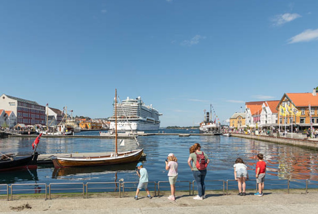 Vågen harbour in Stavanger with a cruise ship docked beside waterfront buildings — same hero image as Stavanger Shore Excursions